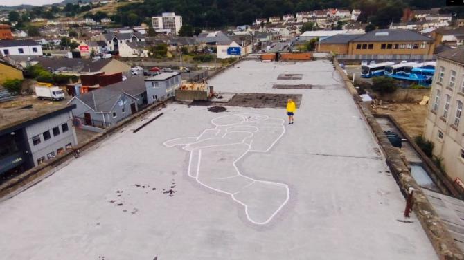 Artist creates giant astronaut on Newry art centre roof as it reopens after 18 months