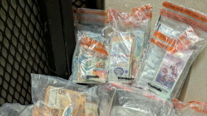 £1/4M AND DRUGS UNCOVERED IN NEWRY
